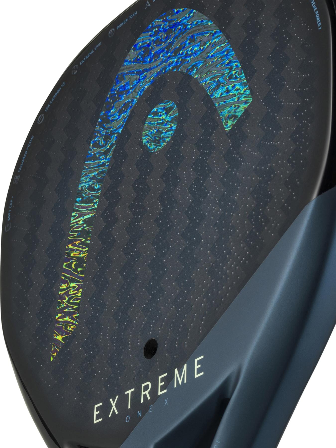 Close-up of the HEAD Extreme One X 2025 Padel Racket in Black/Blue, featuring 12K carbon fibre, advanced surface texture, and a blue holographic HEAD logo. "EXTREME ONE X" appears near the bottom of the racket.