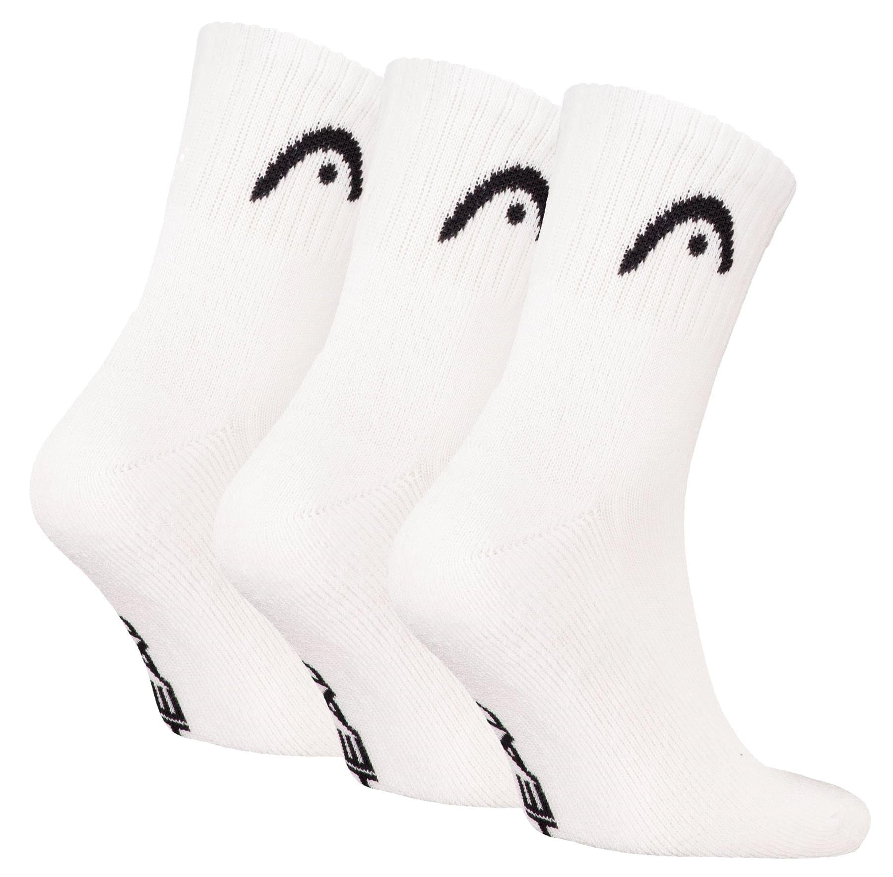 Three pairs of HEAD Club Short Crew Padel Socks in white, each with a black curved logo near the top and black text on the sole, made from soft cotton for comfort. Brand: HEAD. Displayed side by side against a white background.