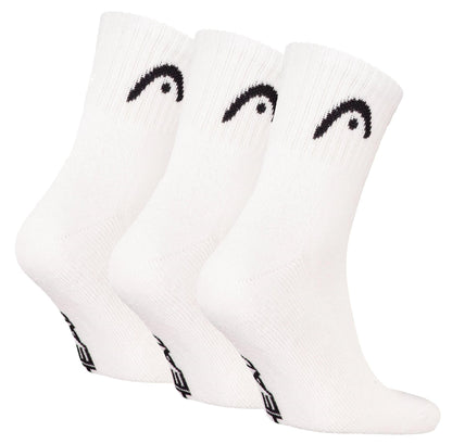 Three pairs of HEAD Club Short Crew Padel Socks in white, each with a black curved logo near the top and black text on the sole, made from soft cotton for comfort. Brand: HEAD. Displayed side by side against a white background.