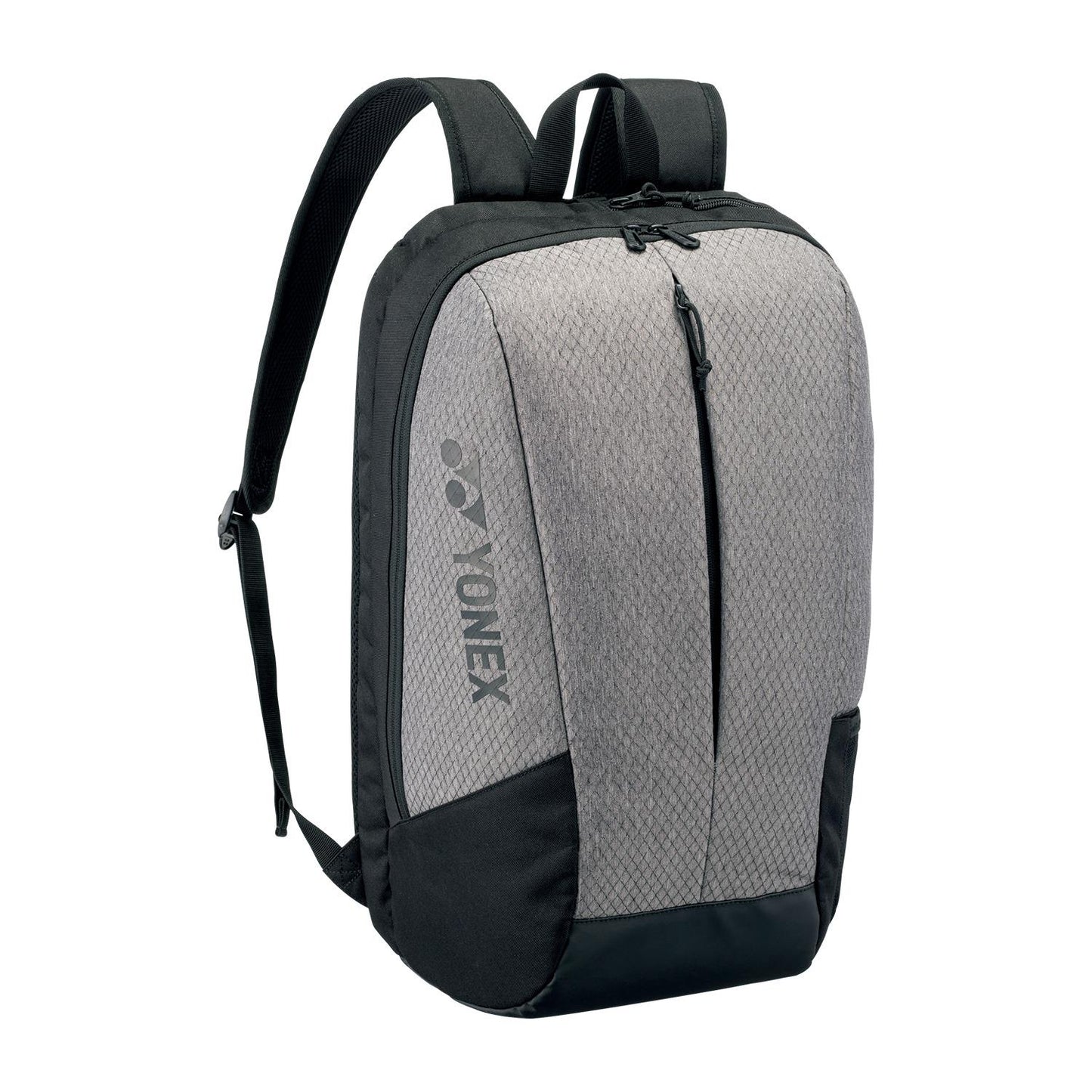 The Yonex 42512EX Team Padel Backpack is lightweight and compact, showcasing a geometric-patterned gray front with black sides. It has two adjustable shoulder straps, a top handle, and a zipper closure. The Yonex logo is prominently printed on the front, ideal for racket sports enthusiasts.