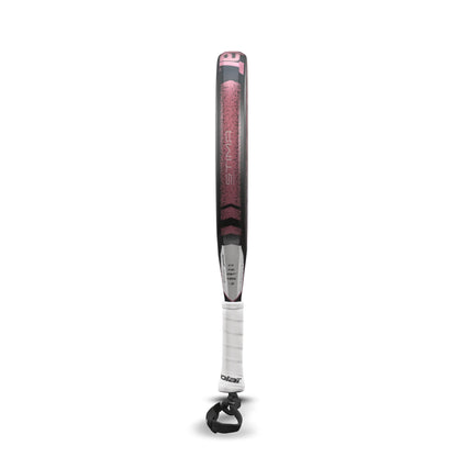 A Babolat Stima Spirit padel racket in black and coral stands upright, showcasing a sleek design and maximum maneuverability. It features a white grip at the handle and includes a black strap at the bottom for extra control.