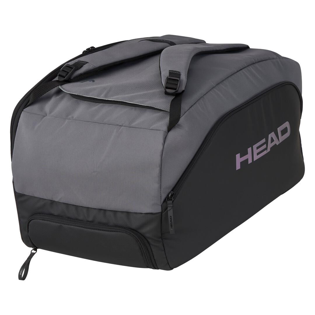 The HEAD Pro X Padel Duffle Bag in black and dark grey, branded with "HEAD" in purple, is a sustainable option made from recycled PET bottles. It features shoulder straps and multiple zippered compartments for essentials.