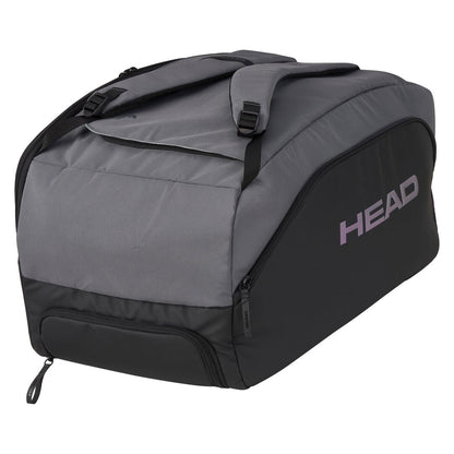 The HEAD Pro X Padel Duffle Bag in black and dark grey, branded with "HEAD" in purple, is a sustainable option made from recycled PET bottles. It features shoulder straps and multiple zippered compartments for essentials.