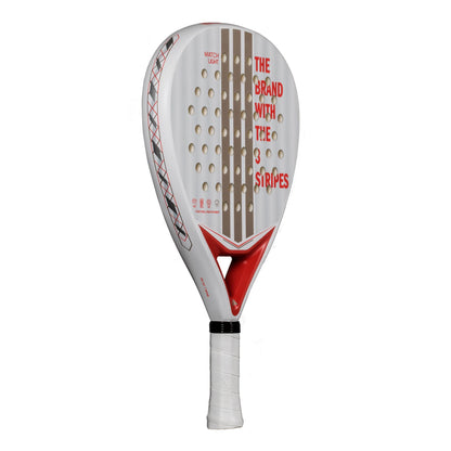 The ADIDAS Match Light 3.4 Padel Racket in clear/red features a lightweight design with red and beige patterns, white grip tape, perforated head, and the iconic "THE BRAND WITH THE 3 STRIPES" text; perfect for beginners.