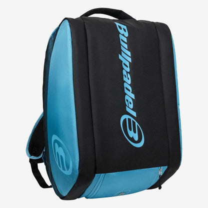 The Bullpadel BPP26003 Vertex W Padel Bag in light blue carries your padel gear, featuring a spacious main compartment, side handle, and Bullpadel logos on the front and side.