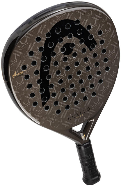 The HEAD Coello Vibe 2026 Padel Racket features a black and brown fibreglass design with a large "HEAD" logo, multiple circular holes, textured surface, "COELLO" by the throat, and a handle wrapped in black grip tape.