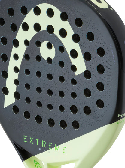 Close-up of the HEAD Extreme Pro 2026 Padel Racket face in black and light green, designed with multiple circular holes and highlighted by the “HEAD” logo and “EXTREME” in bold green text near the lower edge—a top choice for advanced padel players who want ultimate power on the court.