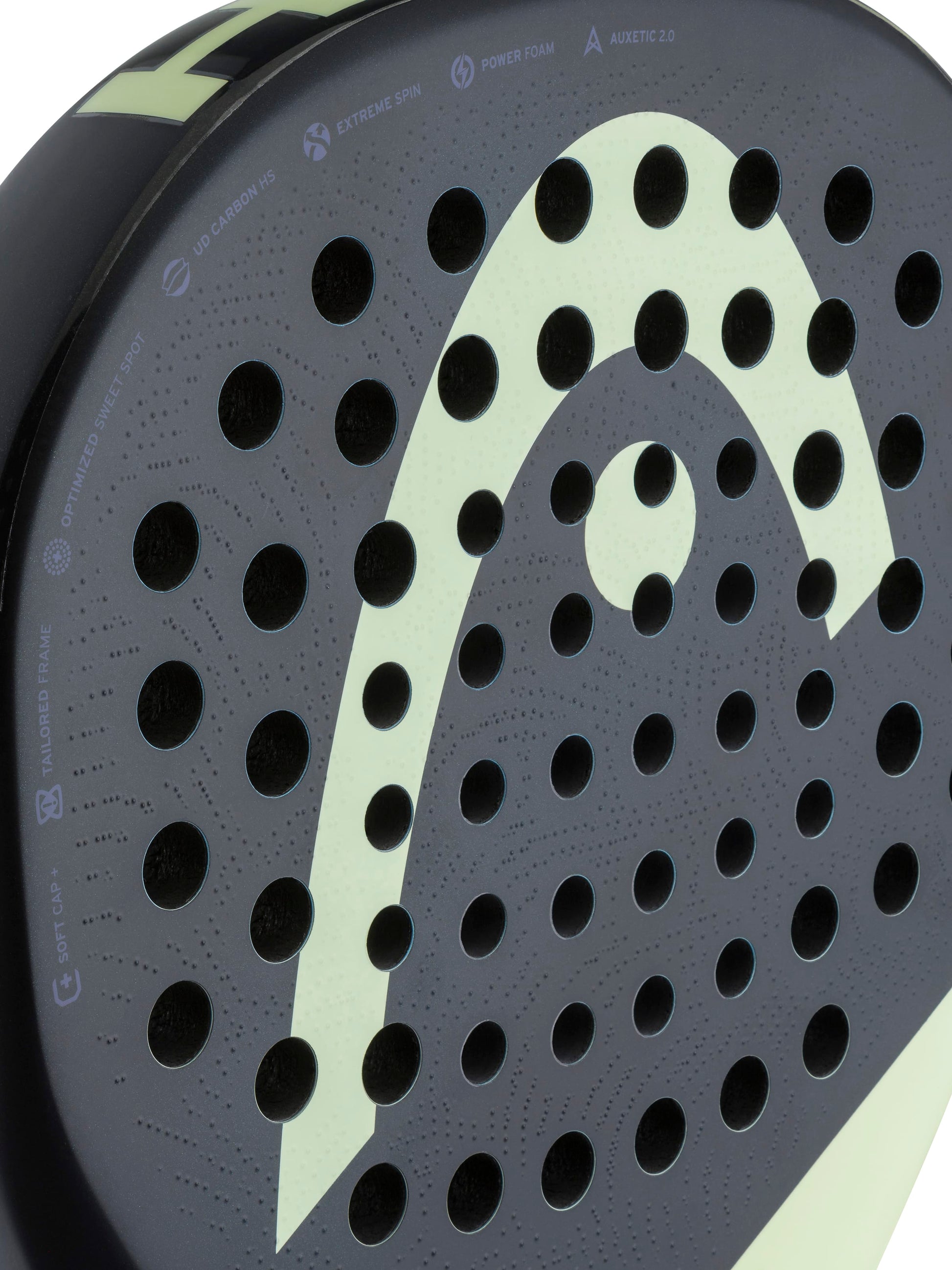 Close-up of the HEAD Extreme Pro 2026 Padel Racket, a high-power padel racket from HEAD designed for advanced players, featuring a sleek black surface with round perforations and a distinctive light green curved graphic, accompanied by various technical icons and branding text near the rim.