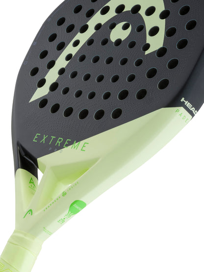 Close-up of the HEAD Extreme Pro 2026 Padel Racket in black and light green, highlighting its perforated face, the prominent HEAD logo, and a portion of the grip—an ideal choice for advanced players seeking power on the padel court.