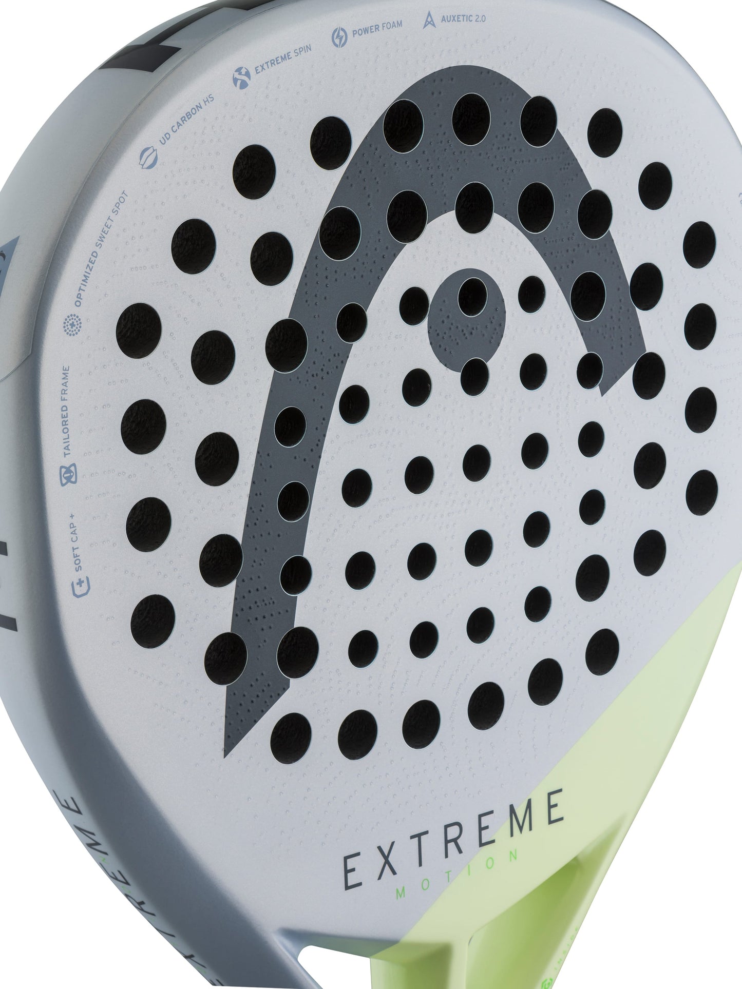 Close-up of the HEAD Extreme Motion 2026 Padel Racket, featuring a white face with black holes and a prominent gray HEAD logo. Its bottom edge showcases a striking neon yellow-green accent, while “EXTREME” is printed near the base. Ideal for advanced padel players, this racket combines power and outstanding performance on the court.