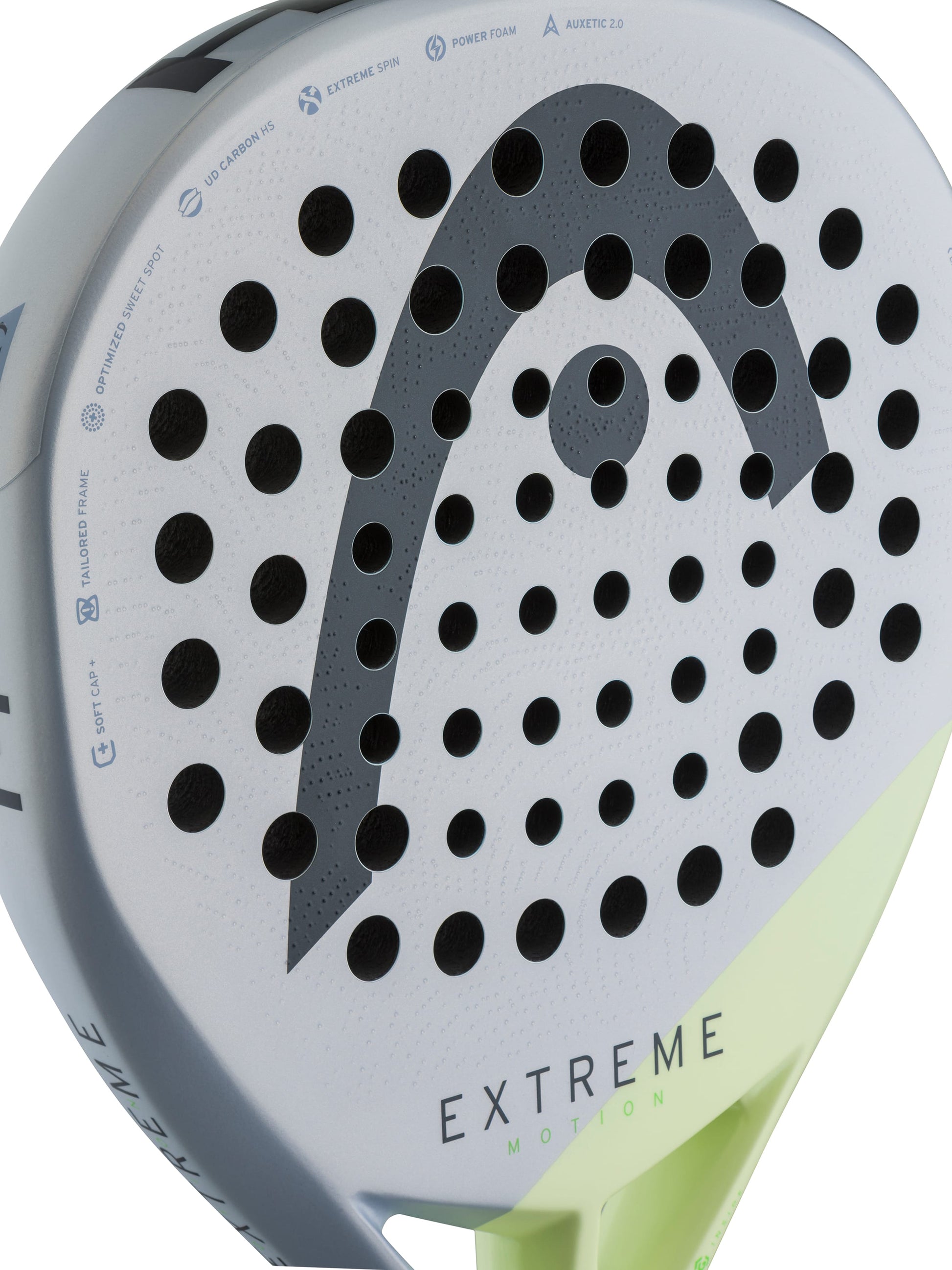 Close-up of the HEAD Extreme Motion 2026 Padel Racket, featuring a white face with black holes and a prominent gray HEAD logo. Its bottom edge showcases a striking neon yellow-green accent, while “EXTREME” is printed near the base. Ideal for advanced padel players, this racket combines power and outstanding performance on the court.