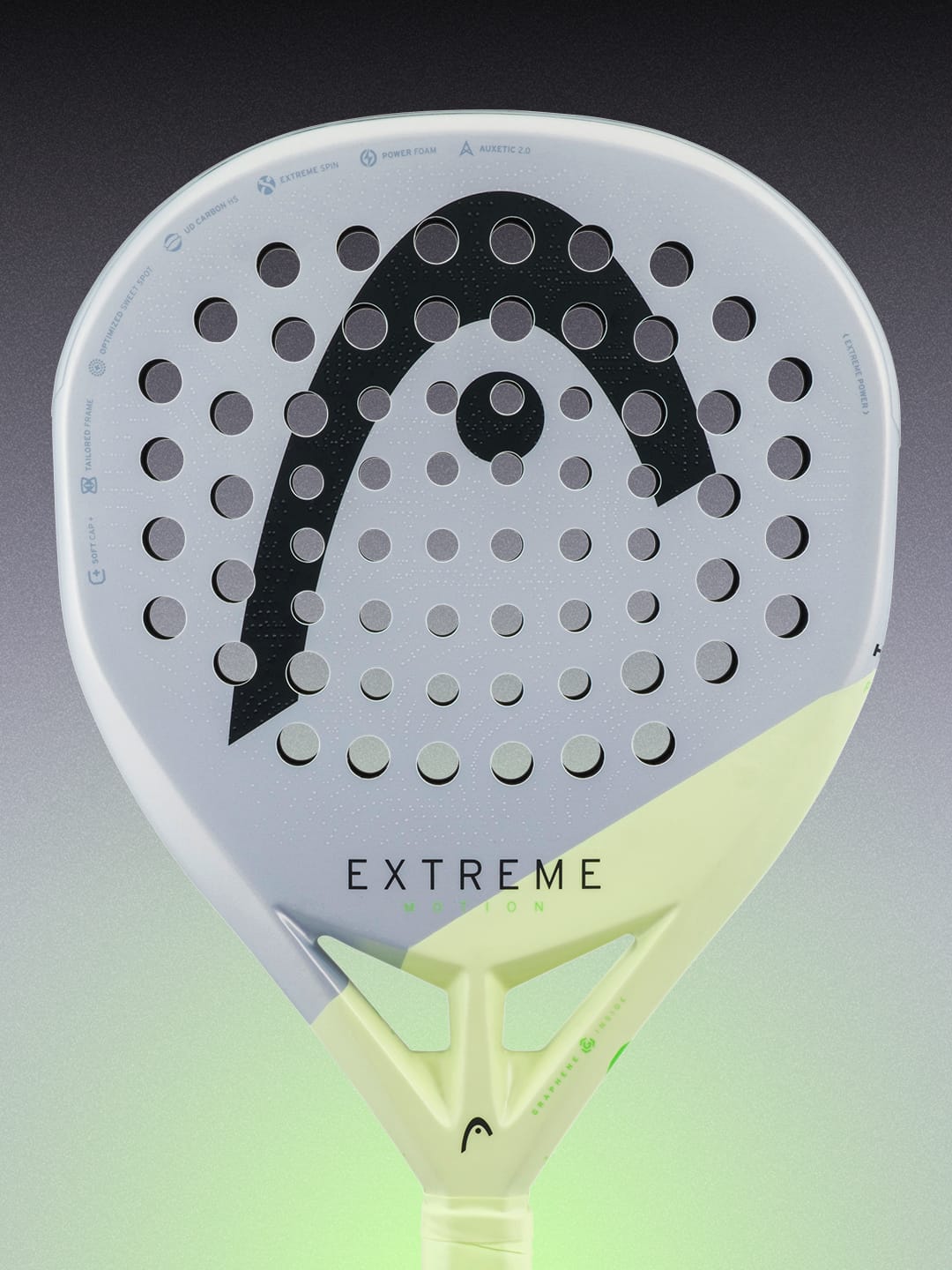 Here’s a rewrite using your product data: A close-up of the HEAD Extreme Motion 2026 Padel Racket, a light gray power racket from HEAD with round holes, featuring a bold black logo and the word “EXTREME” on its face, set against a gradient gray-green background—ideal for advanced padel players who demand precision and top performance.