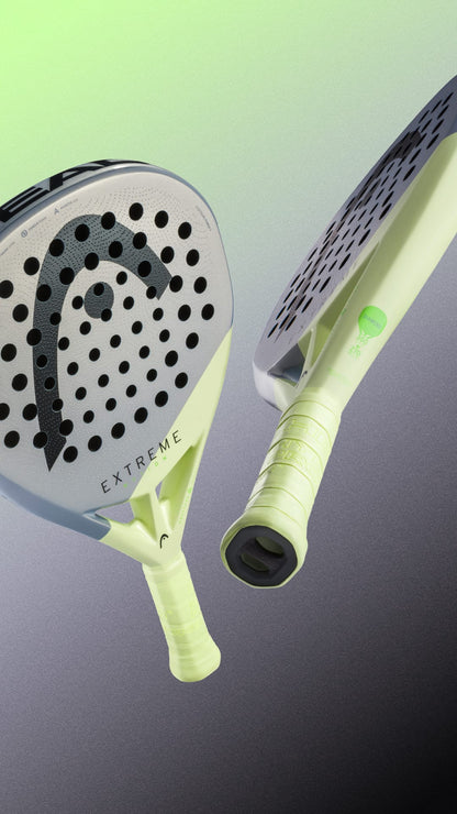 Two modern padel rackets are displayed on a gradient background fading from green to gray, including the HEAD Extreme Motion 2026 Padel Racket by HEAD, designed for advanced padel players and featuring perforated surfaces with light green grips.
