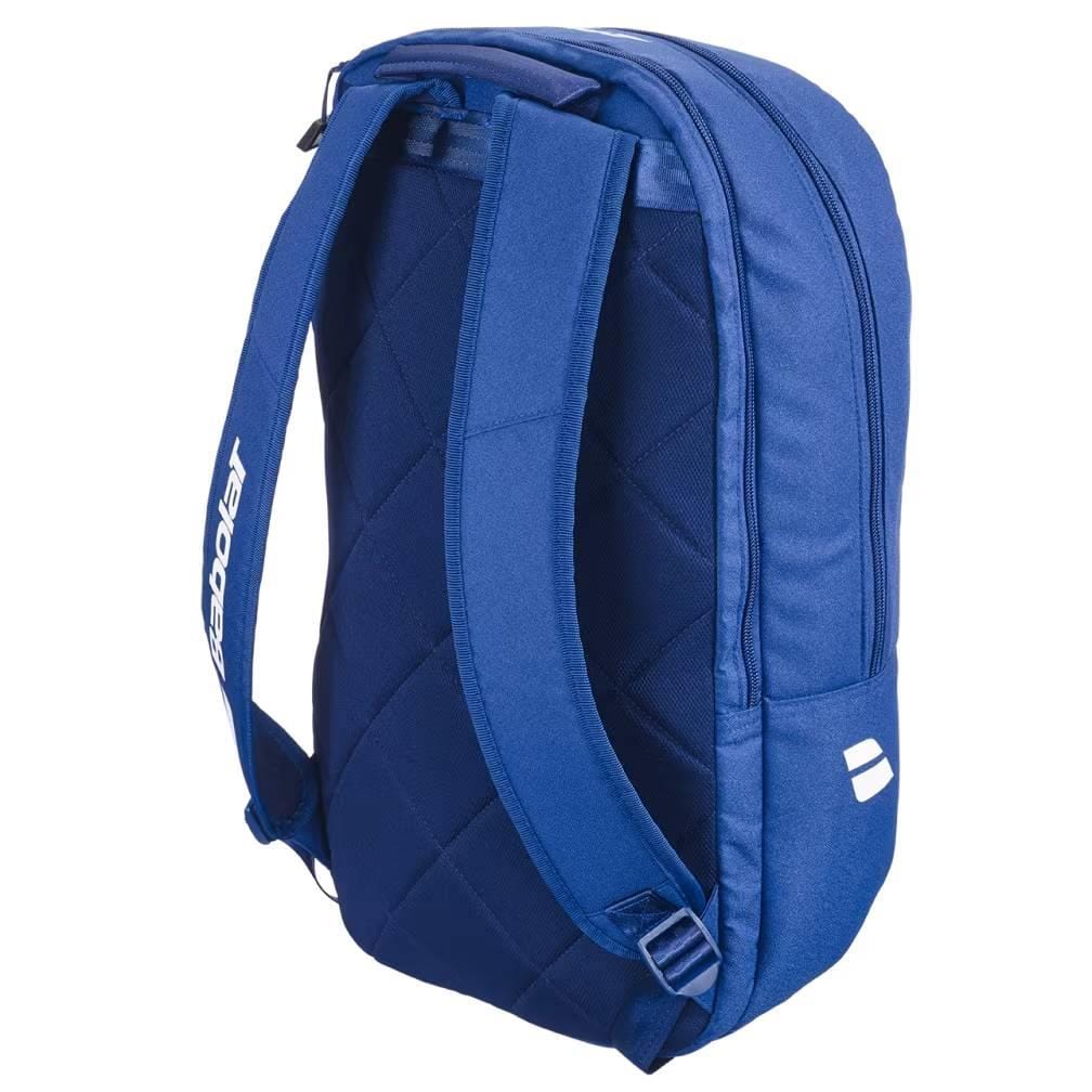The Babolat Court Lite Padel Backpack - Dark Blue by Babolat features quilted back padding, adjustable shoulder straps, a white side logo, and a dedicated racket compartment. Shown from an angled rear view against a white background.