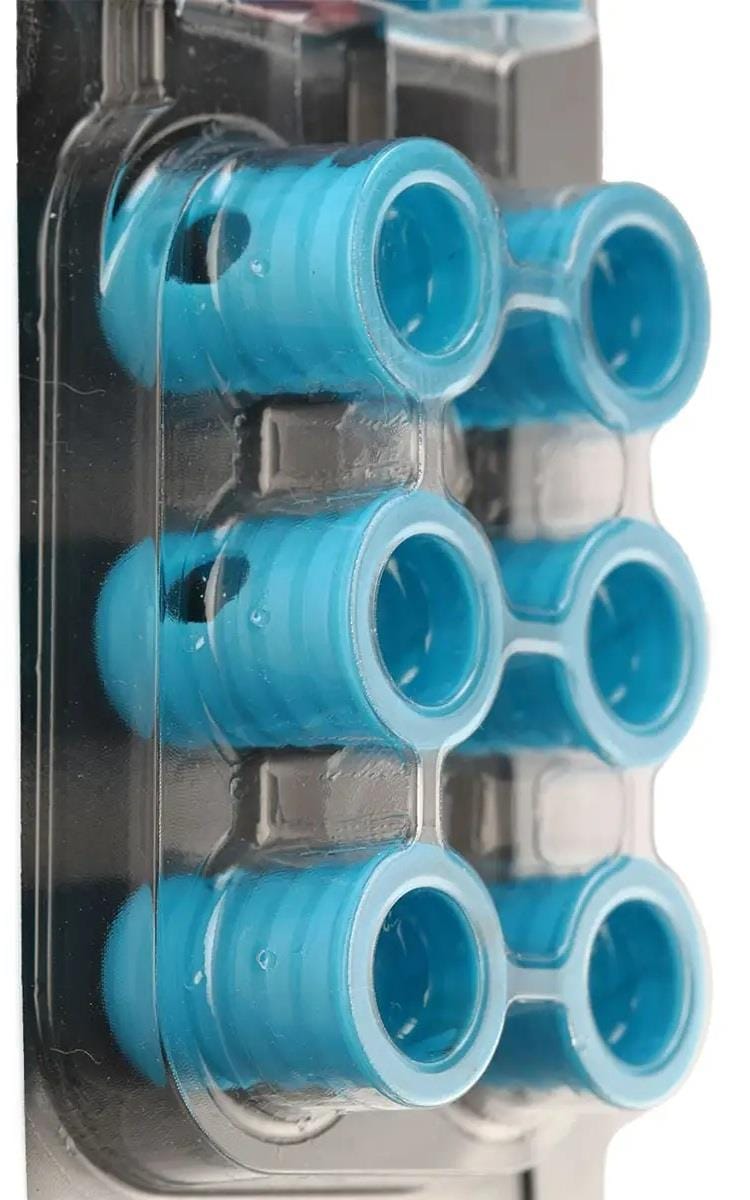 A close-up of a plastic blister pack holding six Bullpadel Ease Vibe Padel Dampeners in Sky Blue, each with ridged sides and hollow centers, arranged in two rows of three to reduce racket vibrations.