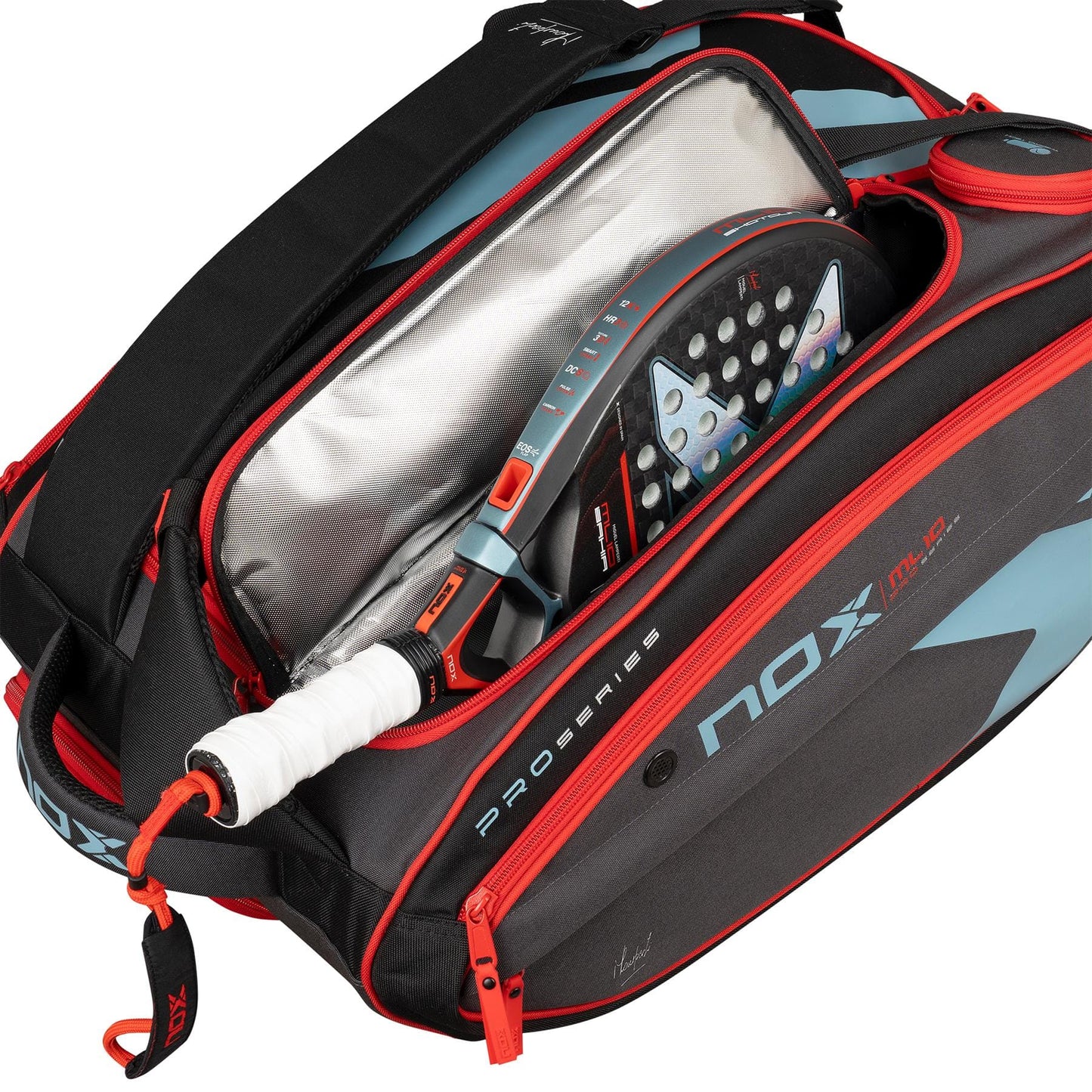 A NOX ML10 Competition XL Compact Padel Racket Bag in black and red is open to reveal a NOX padel racket with a white grip and blue-black face. The bag includes insulated lining and several compartments for storage.