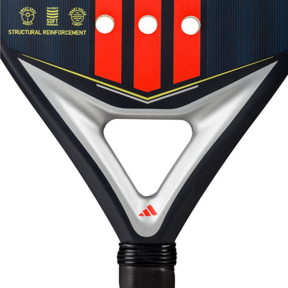 Close-up of the ADIDAS Match Blue 3.4 Padel Racket in Blue/Clear, showcasing a black edge with red design and three circular holes. The AllRound head shape features the adidas logo at the triangular throat, with text in the upper left promoting structural reinforcement and softness.