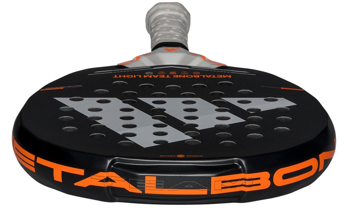 A close-up of the adidas Metalbone Team Light 2026 Padel Racket in black, designed for advanced players, with bold "METALBONE" lettering, circular surface holes, and a wrapped handle.