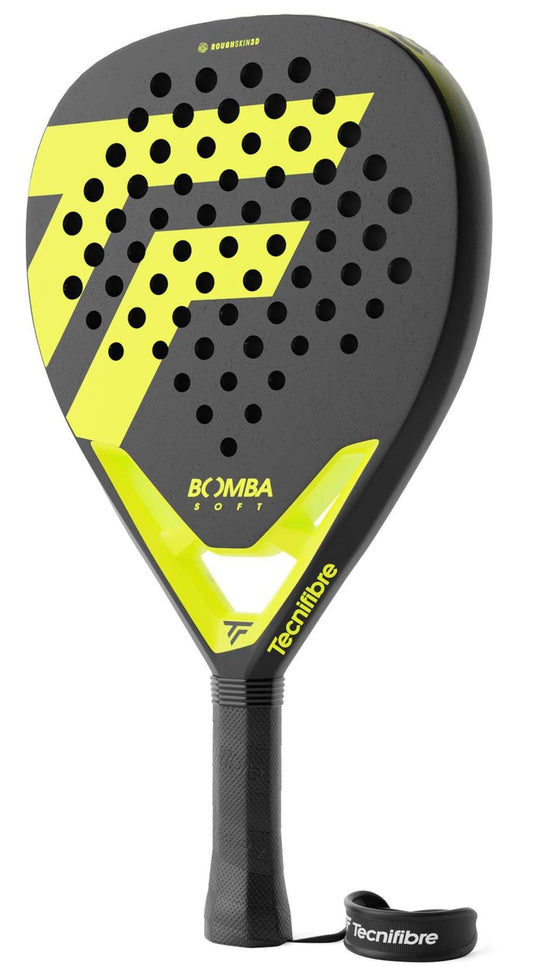 The Tecnifibre Bomba Soft Padel Racket features a yellow and black design with a patterned face, perforated holes, a black grip, and a Tecnifibre-branded wrist strap. "BOOMBA SOFT" is displayed on the racket for added style and comfort.