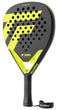 The Tecnifibre Bomba Soft Padel Racket features a yellow and black design with a patterned face, perforated holes, a black grip, and a Tecnifibre-branded wrist strap. "BOOMBA SOFT" is displayed on the racket for added style and comfort.