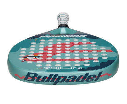 Introducing the Bullpadel Indiga Junior 25 Girls Padel Racket in teal, featuring a red and black design. With Grip Zone technology for better control and distinct "Bullpadel" branding, it includes a matching grip on the handle.