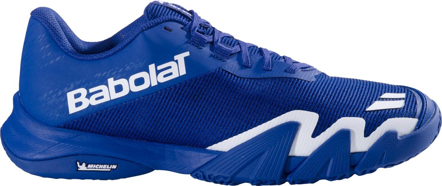 The Babolat Jet Viva Men's Padel Shoes in Marine Blue feature white accents, the iconic Babolat logo text on the side, and a Michelin logo on the sole. Crafted as one of Babolat’s lightweight padel shoes for men, they showcase textured mesh construction and a distinctive zigzag pattern above the outsole.