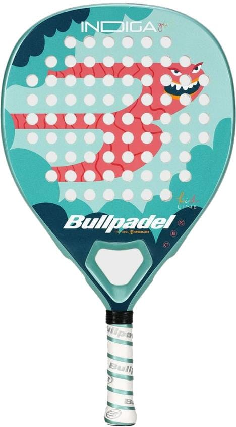 The Bullpadel INDIGA Junior Girls 2026 padel racket features a turquoise and teal design with a cartoon red dragon on the face, white eyes and sharp teeth, plus a white grip on the handle.