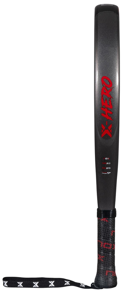 The NOX X-Hero Red Padel Racket by NOX features a dark gray and black design, bold red "X-HERO" lettering, textured black grip, and a wrist strap with white "X" patterns—perfect for beginners seeking control and precision.