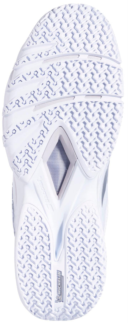 The white sole of the Babolat Premura 3 Womens Padel Shoes by Babolat has a textured tread, grooves, visible branding, and a midfoot cutout for enhanced performance.