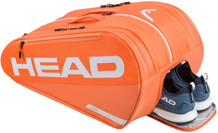A HEAD Tour 2026 Padel Racket Bag L - Orange by HEAD, with white zippers and logo, is shown with a separate compartment partially open to reveal navy and white athletic shoes inside.