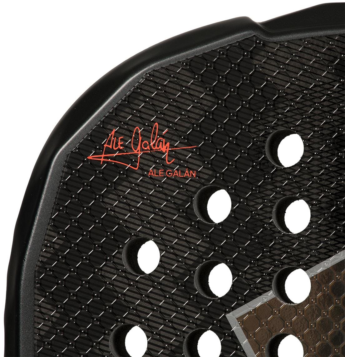 Close-up of the adidas ADIDAS Metalbone HRD+ by Ale Galán 2026 padel racket in black and red, featuring textured details, round holes, a red signature, and "ALE GALÁN" printed on the surface.