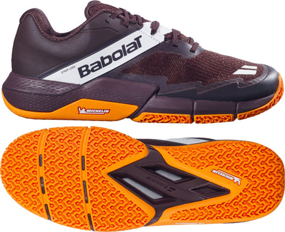 A pair of Babolat Movea 2 Men's Padel Shoes in brown and cream, featuring an orange sole. The top image displays a side view, while the bottom image showcases the textured outsole with both Babolat and Michelin logos, emphasizing these high-performance men's padel shoes.