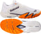 The Babolat Premura 3 Men's Padel Shoes in Cream and Orange, from Babolat, feature striking orange and black accents. Displayed from the side and bottom, these shoes showcase a sole with textured orange and white patterns that deliver excellent traction—making them perfect for quick, agile movements on the padel court.