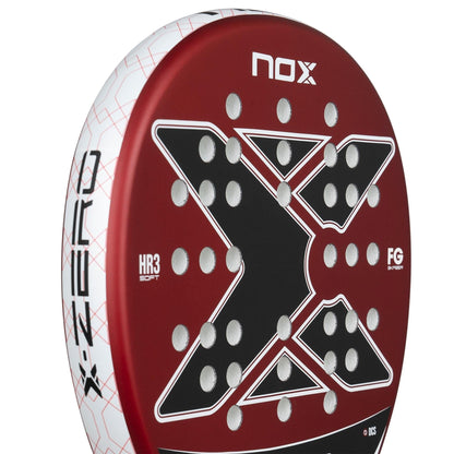 Close-up of the NOX X-Zero Red Padel Racket by NOX, a control racket with a bold black "X," white dots on a vibrant red background, and detailed branding along the frame.