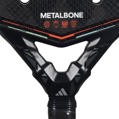 Close-up of the adidas Metalbone by Ale Galán 2026 Padel Racket - Black, showing the adidas logo, branding, and textured geometric patterns with icons above the handle of this adjustable weight padel racket.