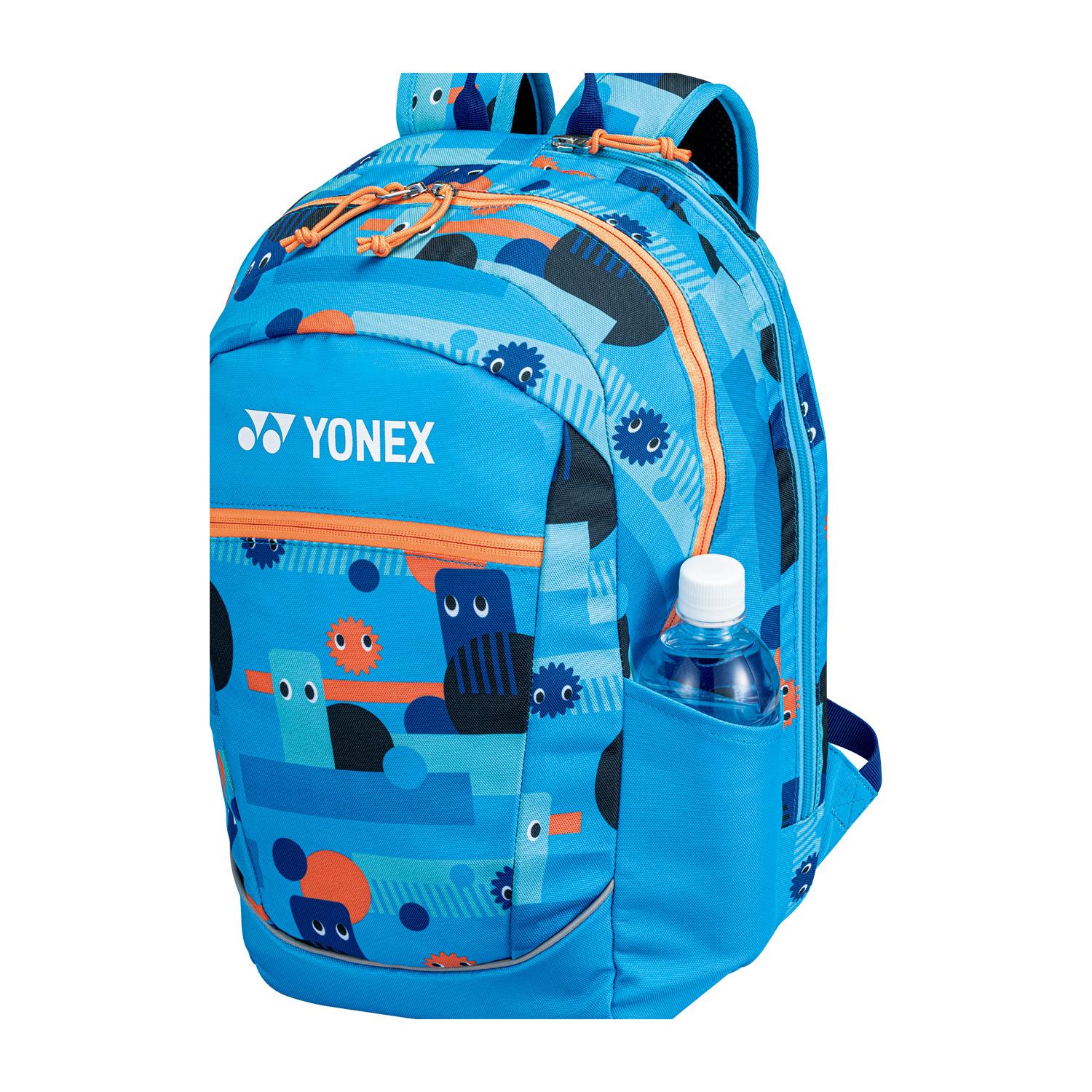 The Yonex 22512 Junior Padel Backpack in Ocean Blue adds vibrancy to your padel gear with colorful patterns and abstract shapes featuring small creatures. It includes an orange zipper and a side pocket ideal for a bottled drink.