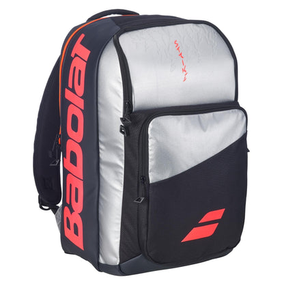The Babolat Pure Strike Tennis Backpack - Carbon Grey features a large front pocket, side compartments, and bold Babolat branding on the side and front pocket.