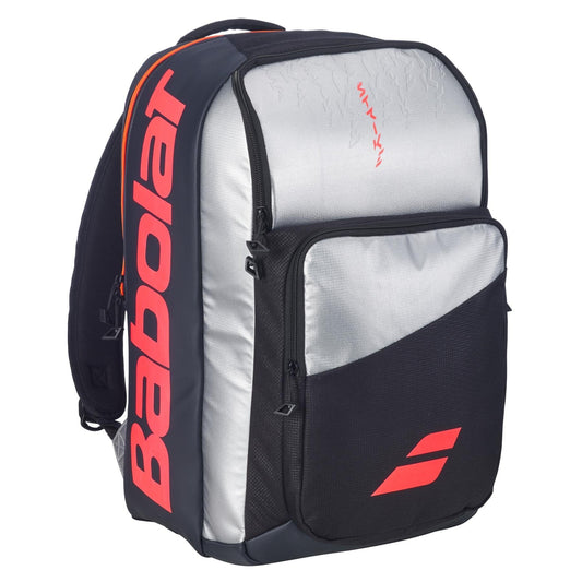 The Babolat Pure Strike Tennis Backpack - Carbon Grey features a large front pocket, side compartments, and bold Babolat branding on the side and front pocket.