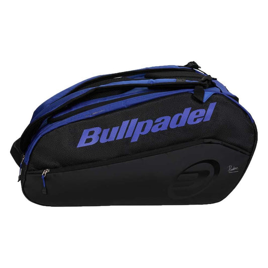 The Bullpadel BPP26002 Vertex Padel Bag in Geo Blue features multiple zippers and handles, a bold Bullpadel logo on the side, and ample space—ideal for carrying all your padel equipment.