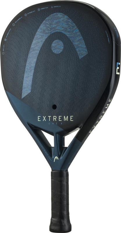 The HEAD Extreme One X 2025 Padel Racket in black and blue features a round shape, a 12K carbon fibre textured surface, and a black grip handle, shown on a white background.