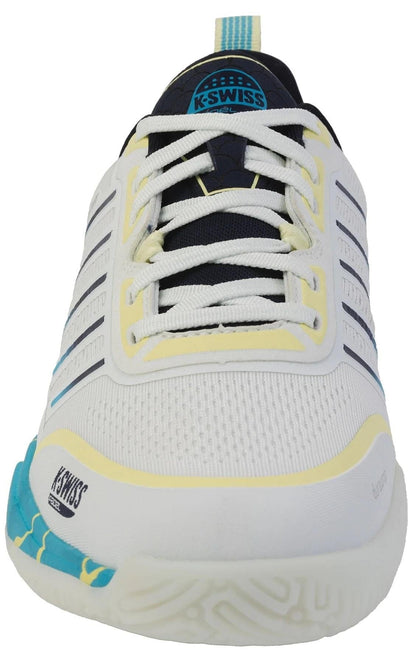 The K-Swiss Ultra Court Mens Padel Shoes in Bit Of Blue/Sanyo Navy/Sanyo Blue feature white uppers, blue and yellow accents, white laces, a textured rubber sole, cushioned midsole, and the K-Swiss logo on the tongue and side.