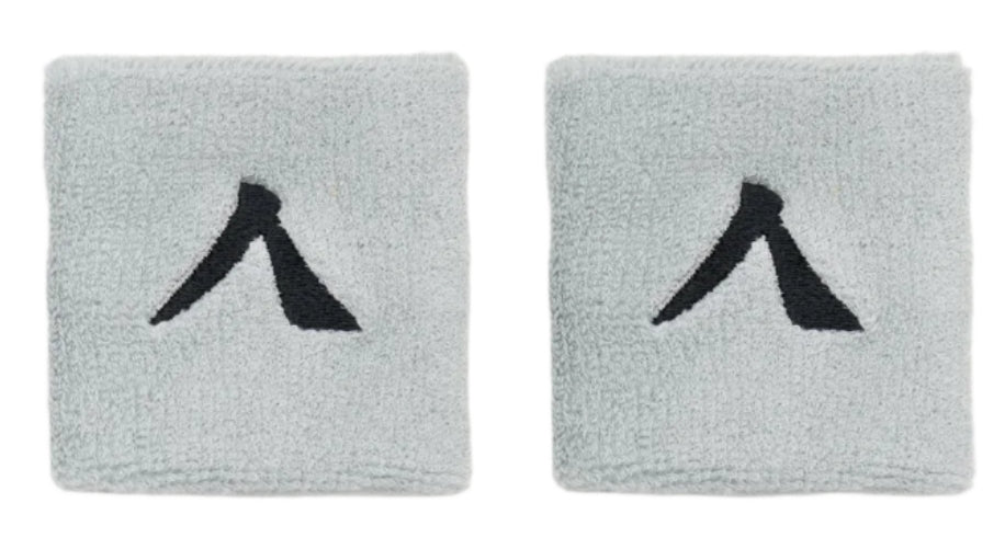 The Kanso 7cm Wristband - 2 Pack in Grey by Kanso offers a stylish, comfortable design with a light gray color featuring an abstract black pattern on white. Made from absorbent fabric, it combines style and practicality for everyday use.