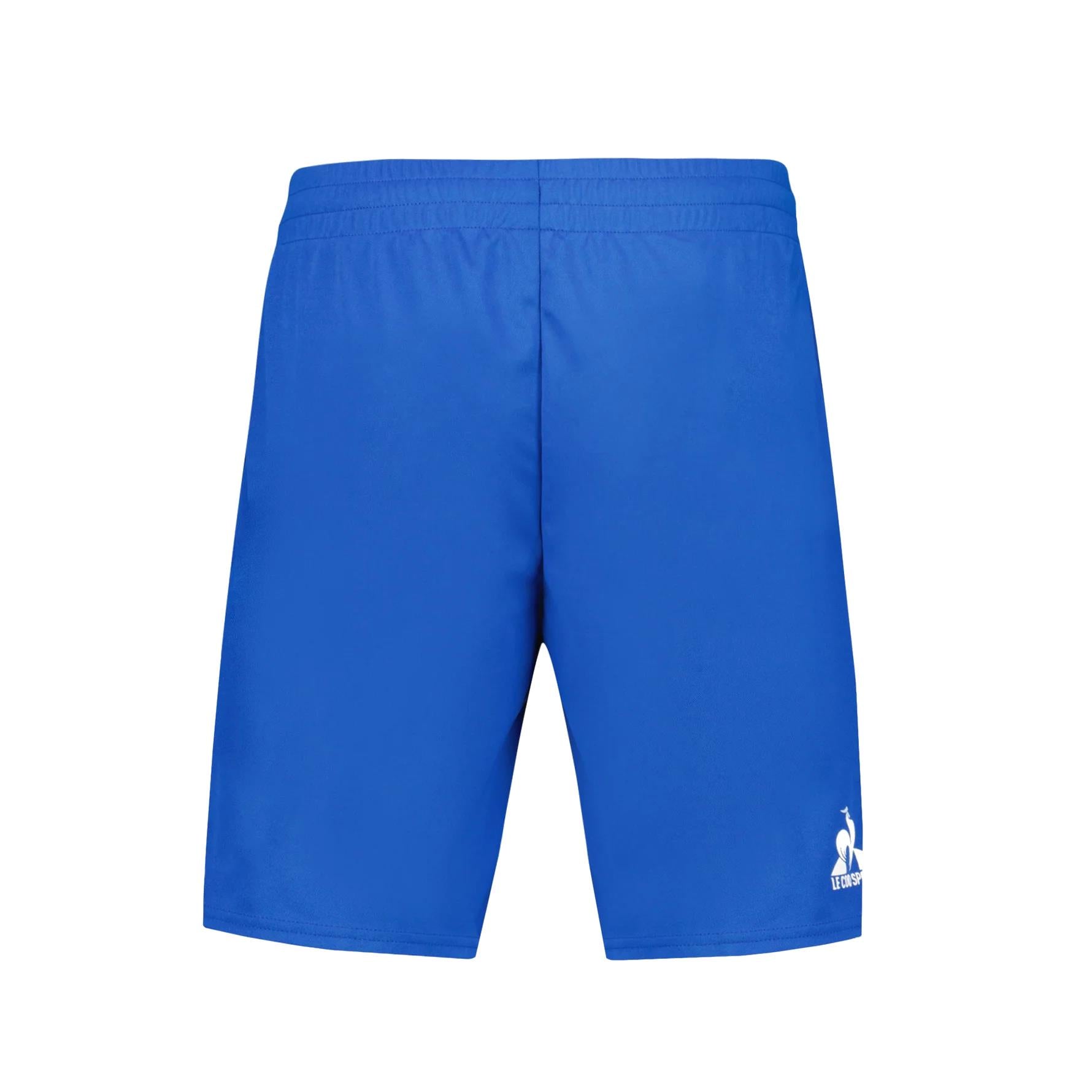 The Le Coq Sportif Pro Men's Padel Shorts in Lapis Blue are ideal for padel or tennis enthusiasts, featuring an elastic waistband and a subtle white rooster logo with text near the bottom of the left leg on a crisp white backdrop.