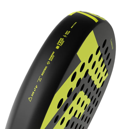 Close-up of the Tecnifibre Bomba Lite Padel Racket by Tecnifibre, showcasing its diamond shape, perforated holes, fibreglass face, and technical details printed near the edge.