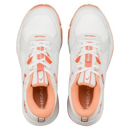 Aerial shot of HEAD Motion Team Women's Padel Shoes in white/coral, showing brand name on the tongue. Designed for stability and comfort, they boast a textured look with coral accents and multi-directional grip soles. Both shoes are displayed side by side.