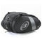 The Bullpadel Neuron 25 Padel Racket Bag is a black motorcycle tail bag with silver accents and a logo on the side, featuring multiple zippered compartments and an aerodynamic design, set against a plain white background.