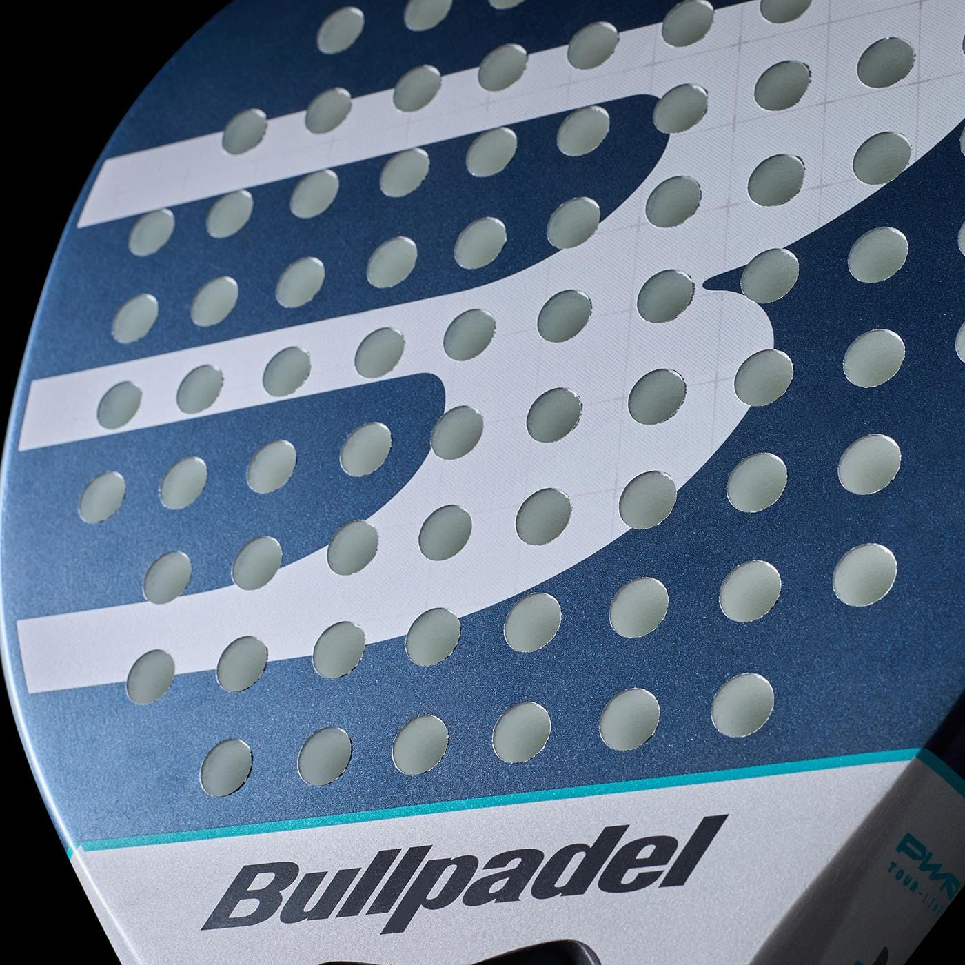 Close-up of the Bullpadel Indiga Pwr 2026 padel racket, featuring a perforated surface, partial Bullpadel logo, and dynamic blue and silver design that showcases the racket's power and performance.