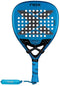 The NOX Luxury EA10 Ventus Attack 12K XTREM By Edu Alonso 2026 Padel Racket features a blue design with a large X in the center, multiple circular holes, and blue grip. Crafted from 12K XTREM Carbon, "NOX" appears on the head and wrist strap.