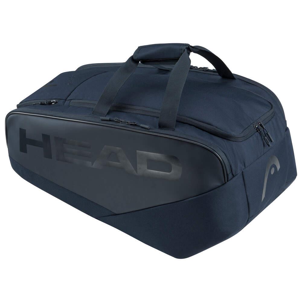 The HEAD Pro Padel Bag L - Navy is a spacious sports bag featuring an innovative backpack carry system for easy transport. It comes in a navy color, has "HEAD" prominently printed on the side, and includes multiple compartments with sturdy handles and a zipper.