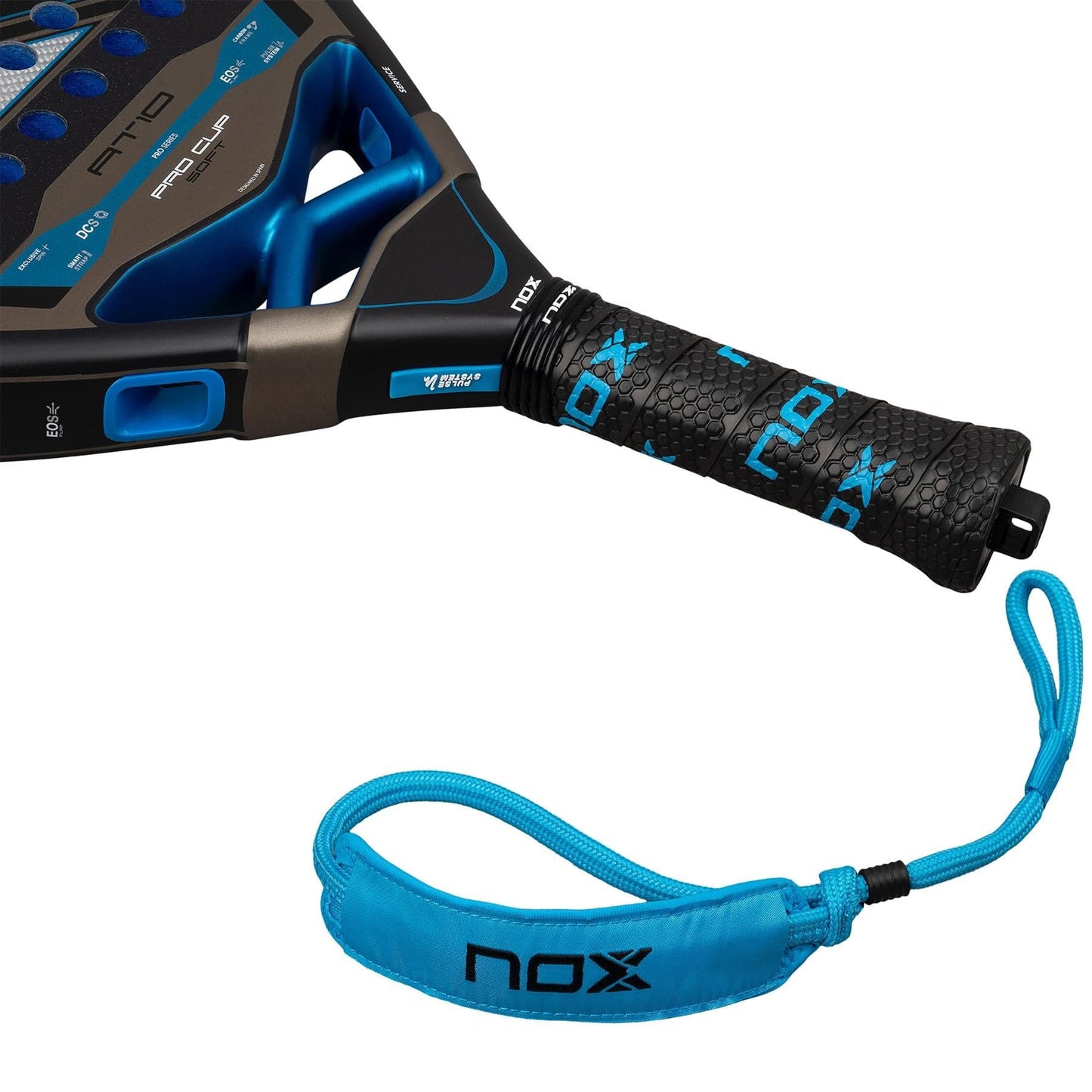 Close-up of the NOX AT10 Pro Cup Soft By Agustín Tapia 2026 padel racket handle with a black grip, blue NOX branding, detachable blue wrist strap, and the NOX logo—designed in collaboration with Agustín Tapia.